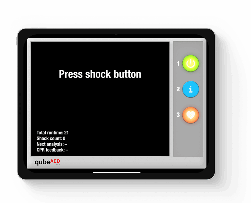 qubeaed_mockup_02web IPad Mockup des Defibrillator Simulators von Skillqube mit "Press shock button" in der Mitte des Bildschirms