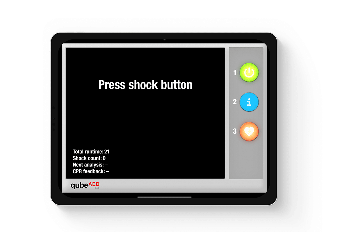 qubeaed_mockup_02web IPad Mockup des Defibrillator Simulators von Skillqube mit "Press shock button" in der Mitte des Bildschirms